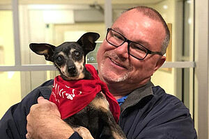 Fudge with his adopter